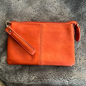 Charming Charlie Orange Wristlet.